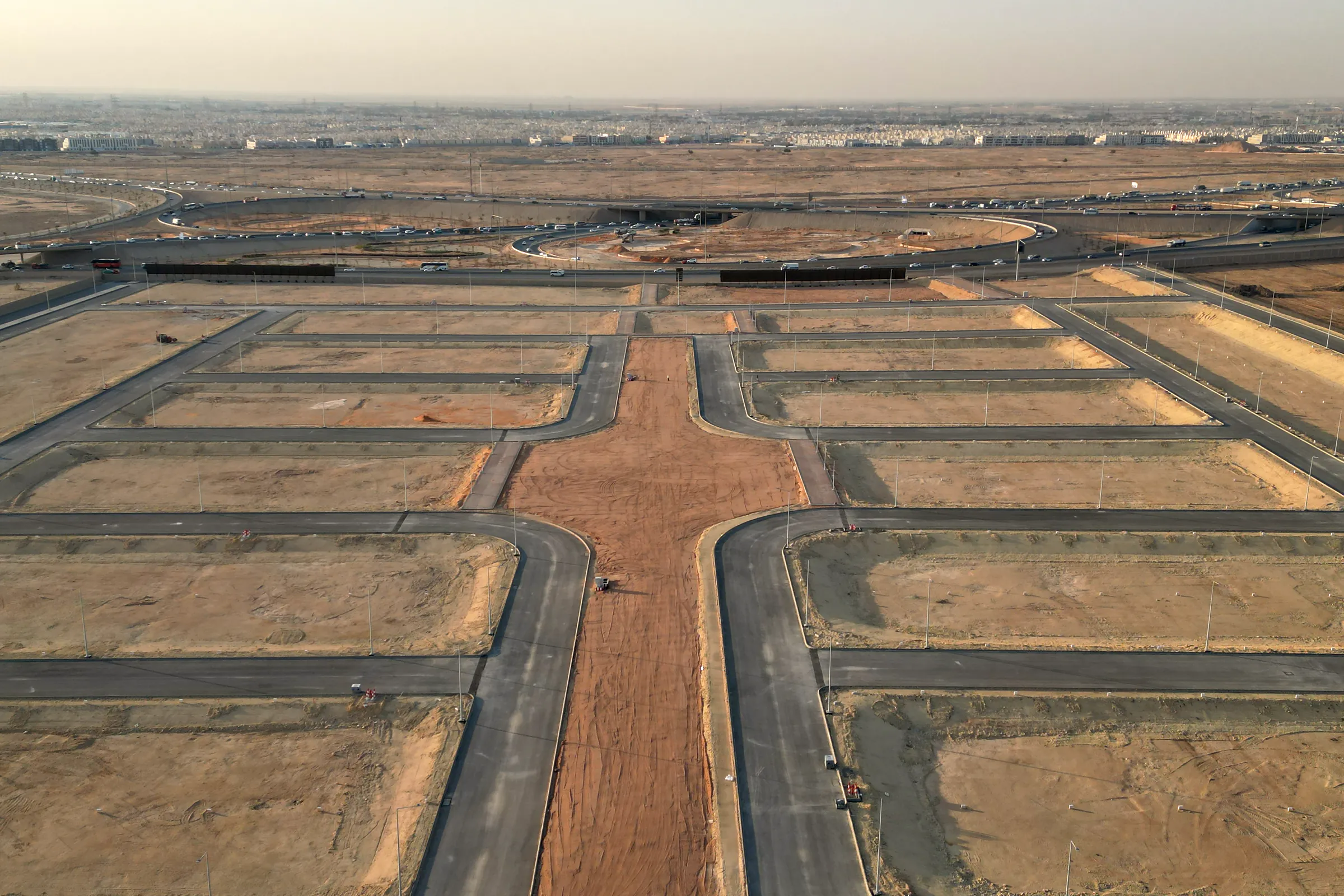 The central strip from the far end of the scheme, leading toward the roundabout