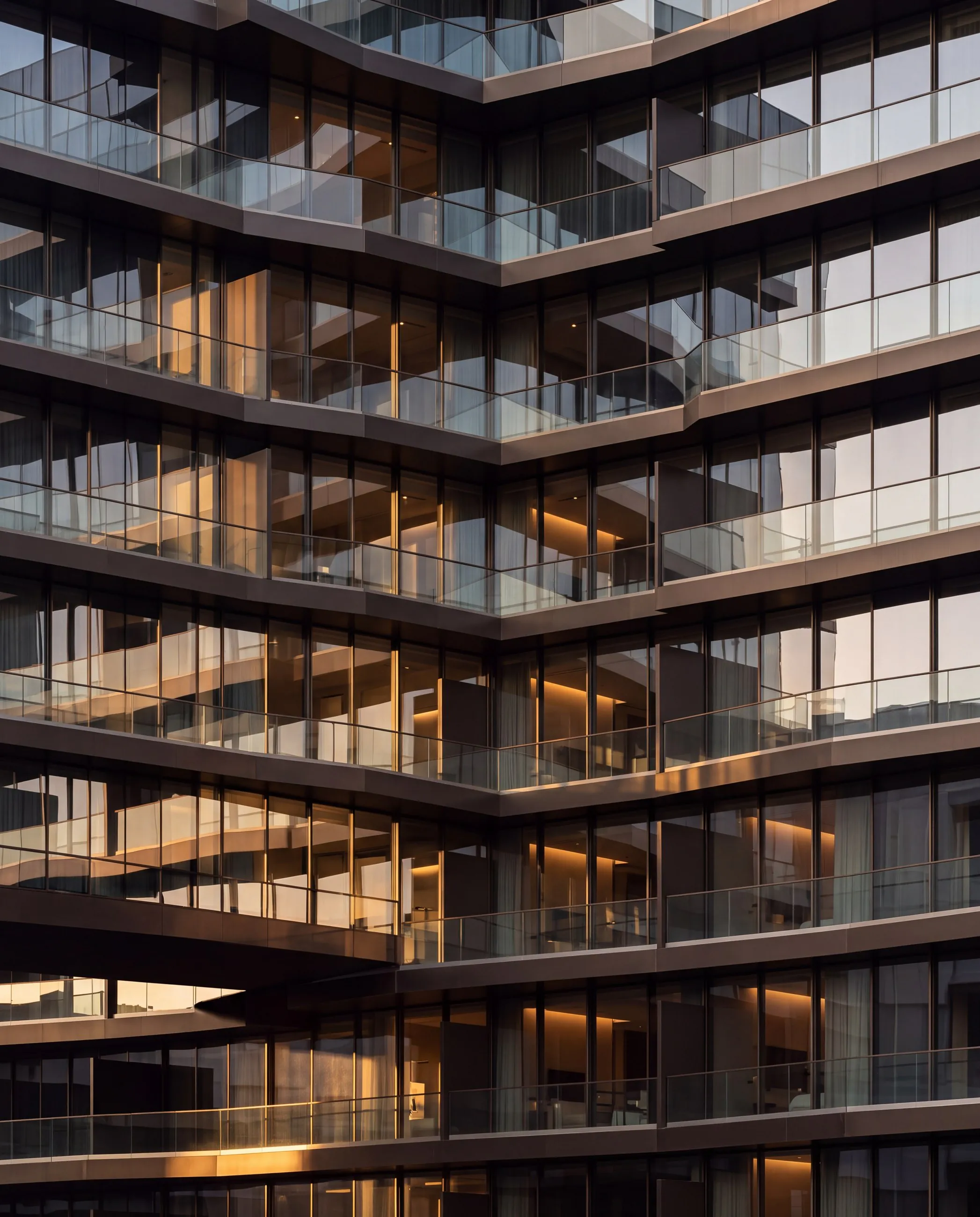 The main building’s balconies catching the evening light.