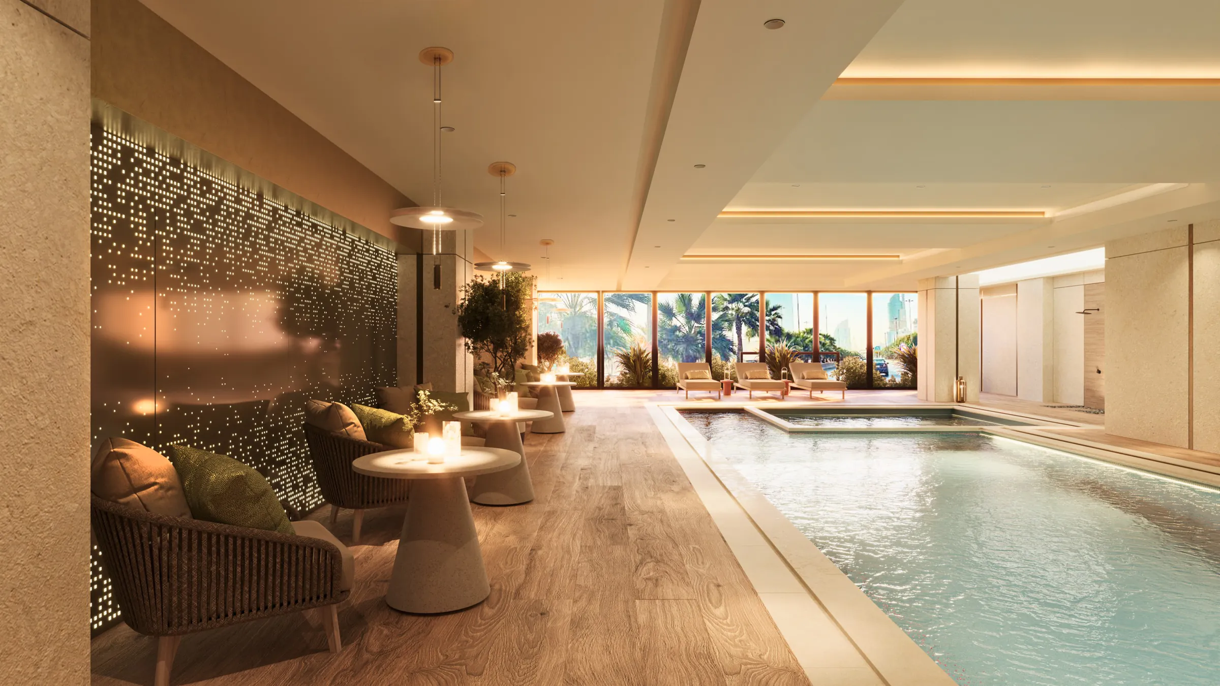 The indoor pool beside lounge seating and a perforated screen that filters warm light.
